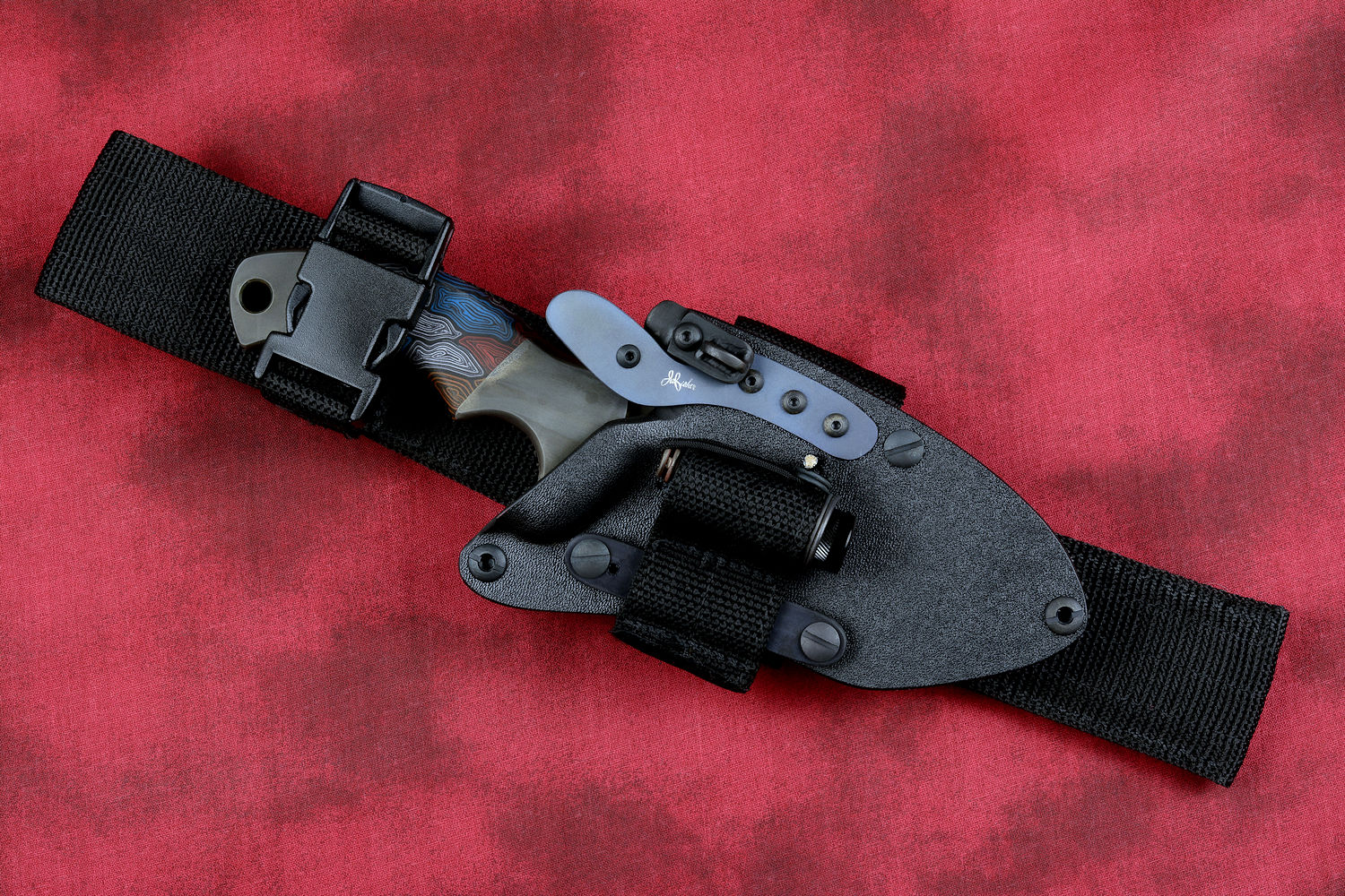 "Krag" tactical, counterterrorism, crossver knife, obverse side view in ATS-34 high molybdenum martensitic stainless steel blade, 304 stainless steel bolsters, multicolored tortoiseshell  G10 fiberglass/epoxy composite handle, hybrid tension tab-locking sheath in kydex, anodized aluminum, black oxide stainless steel and anodized titanium