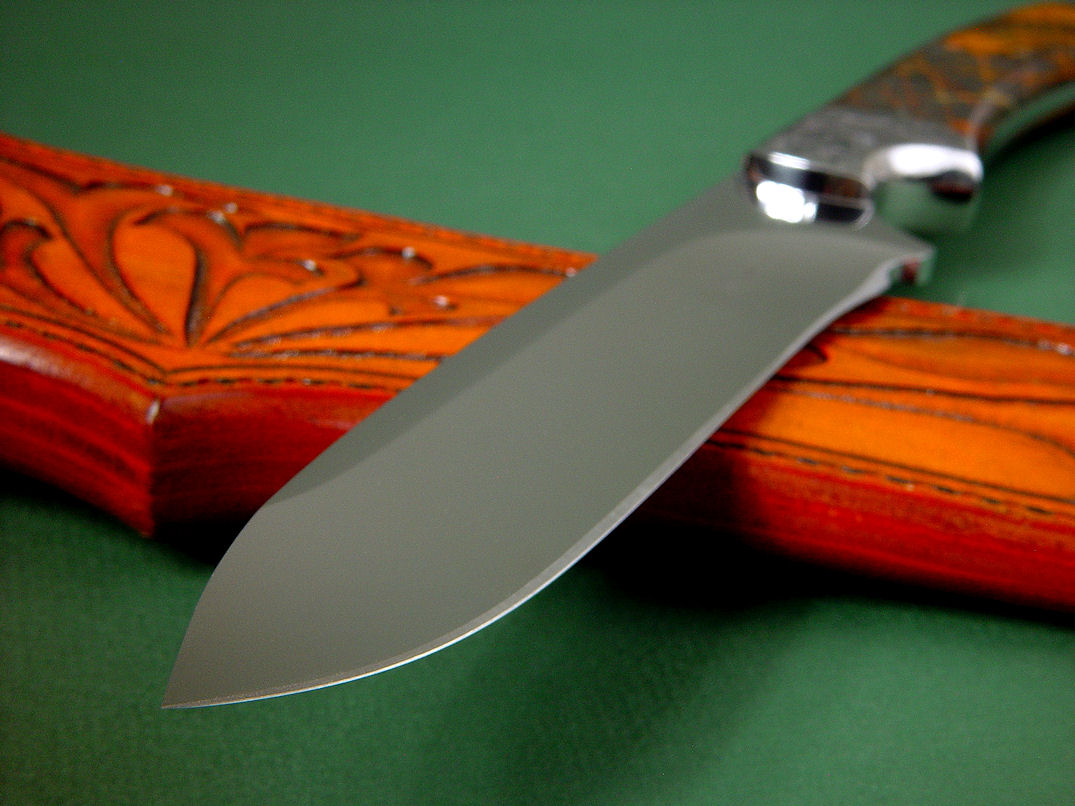 "Magdalena Magnum" obverse side view in D2 extremely high carbon die steel blade, hand-engraved 304 stainless steel bolsters, Pilbara Picasso Jasper gemstone handle, hand-carved, hand-tooled leather sheat