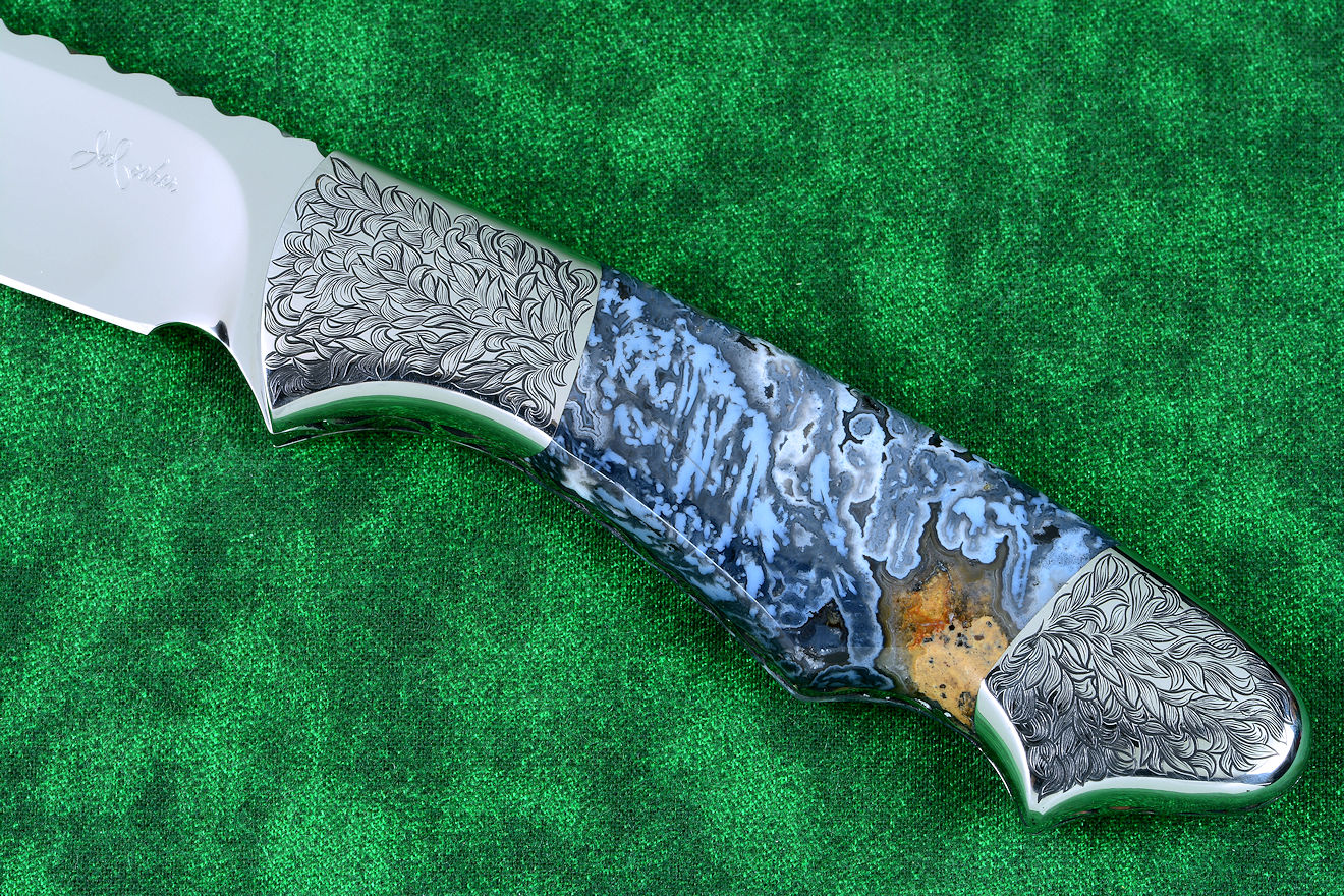 "Thuban" custom knife, obverse side view in CPM154CM powder metal technology, T3 cryogenically treated stainless steel blade, hand-engraved 304 stainless steel bolsters, Moss Agate gemstone handle, hand-carved leather sheath inlaid with frog skin