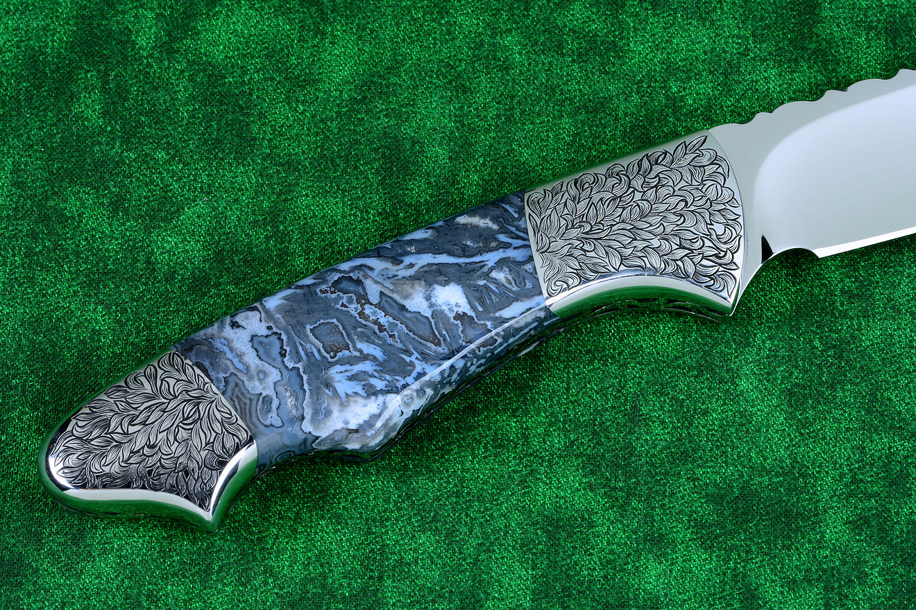 "Thuban" custom knife, obverse side view in CPM154CM powder metal technology, T3 cryogenically treated stainless steel blade, hand-engraved 304 stainless steel bolsters, Moss Agate gemstone handle, hand-carved leather sheath inlaid with frog skin