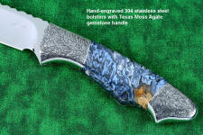 "Thuban" custom knife, obverse side view in CPM154CM powder metal technology, T3 cryogenically treated stainless steel blade, hand-engraved 304 stainless steel bolsters, Moss Agate gemstone handle, hand-carved leather sheath inlaid with frog skin