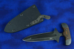 "Vindicator" push/punch counterterrorism tactical defensive dagger: sheath front titanium spring detail. Three included titanium springs let the user adjust the retention strength