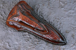 "Vindicator" reverse side view, sheath. Full panels of elephant skin inlay in heavy leather shoulder with black nylon stitching and acrylic sealer