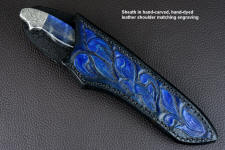 "Carina" obverse side view in mirror polished and hot-blued O1 high carbon tungsten-vanadium tool steel blade, hand-engraved 304 stainless steel bolsters, Labradorite gemstone handle, hand-carved, hand-dyed leather sheath